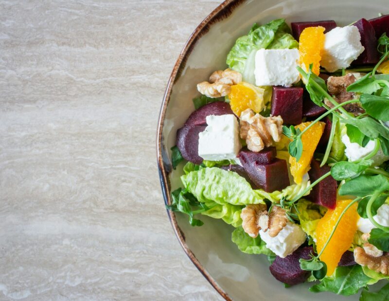 bowl of vegetable salad with walnuts